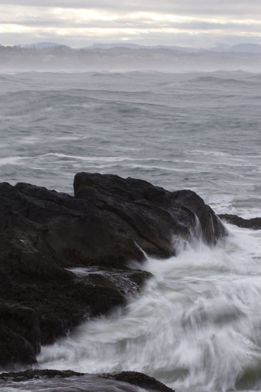 Waves Breaking Against Rocks